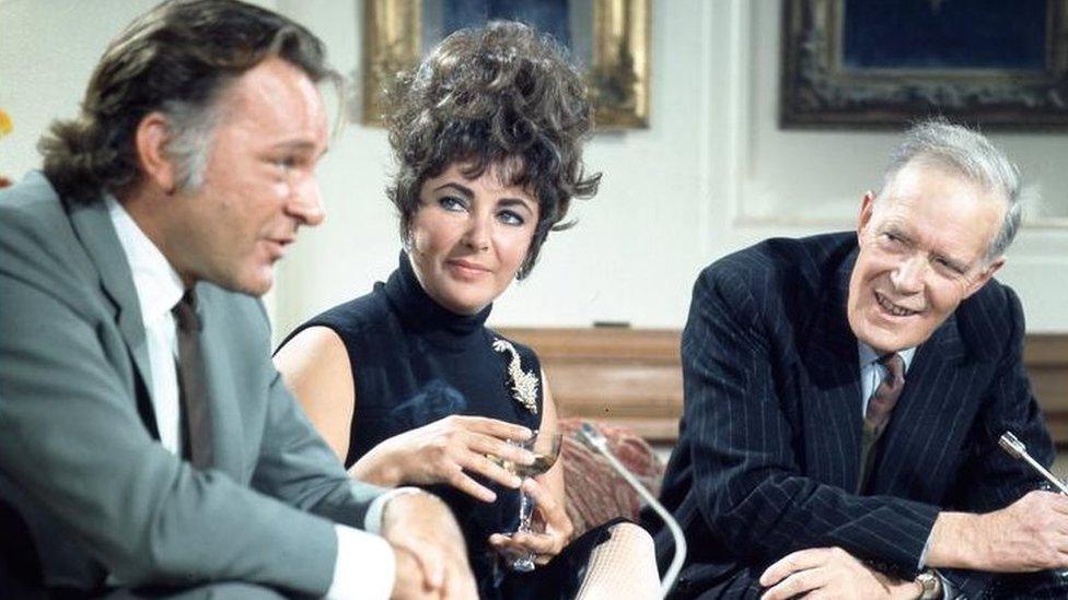 Nevill Coghill (right), with Burton and Taylor in 1967