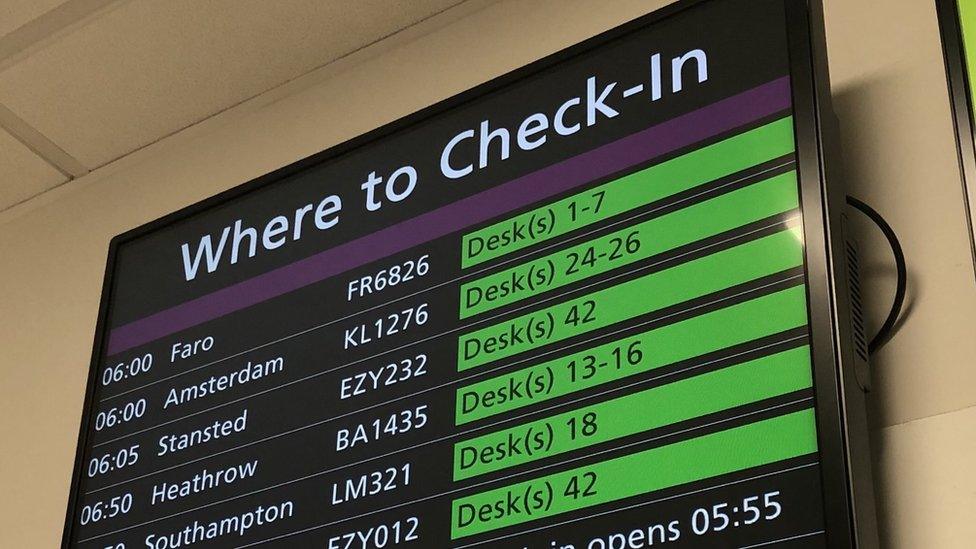 Check in board at Edinburgh airport