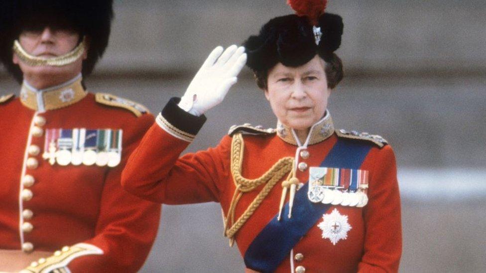 Queen Elizabeth II taking the salute of the Household Guards regiments during the Trooping of the Colour ceremony in London, 1985