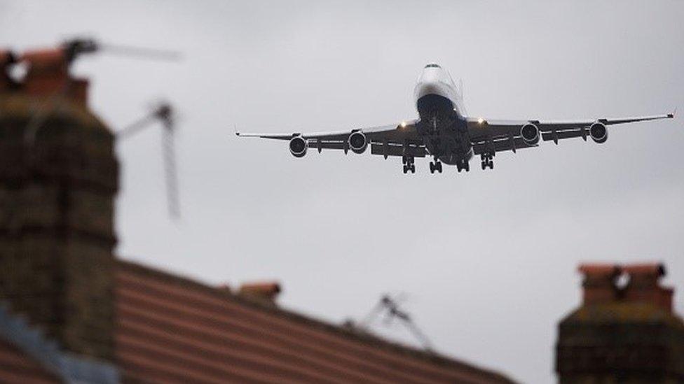 Plane flying over a house to Heathrow