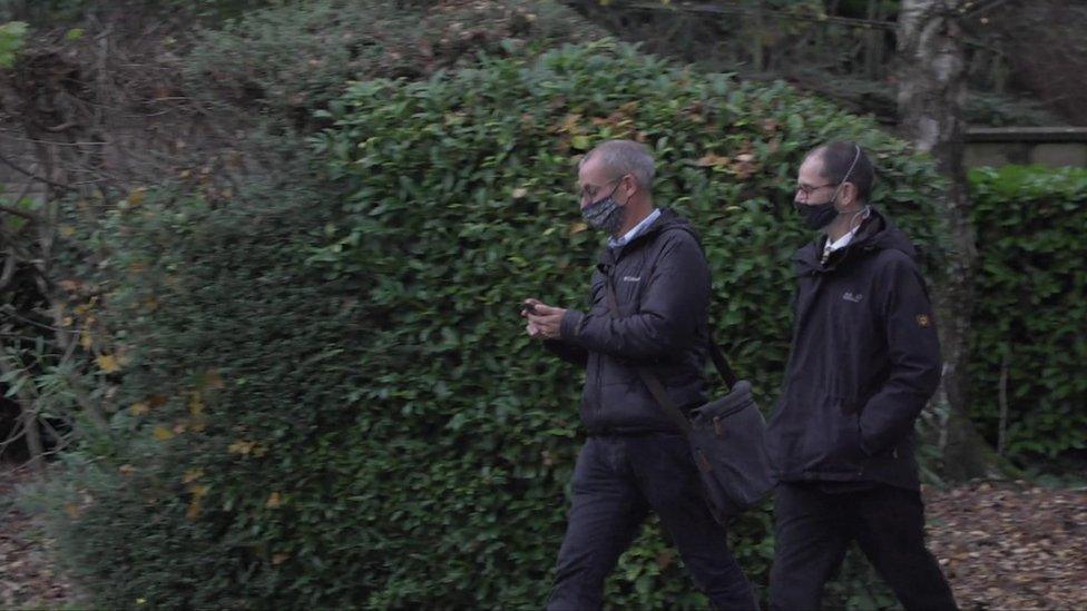 Rev Overend and another man leaving court