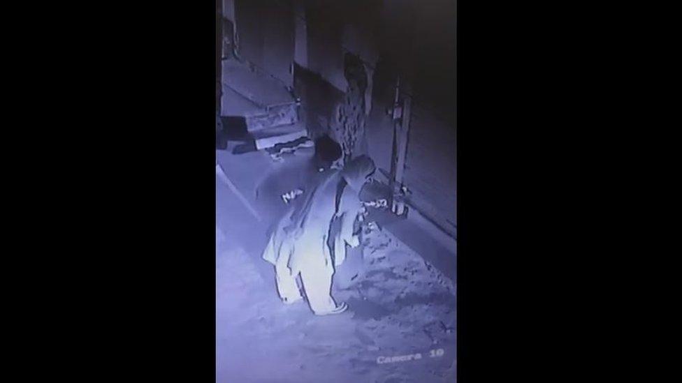 CCTV footage shows family members carrying stools into the house.