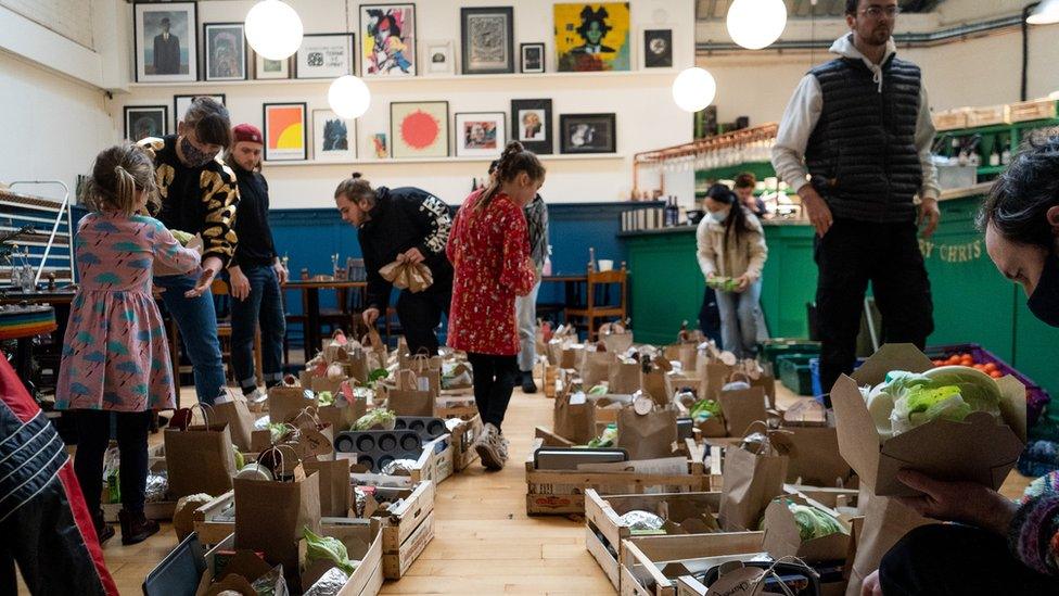 People packing meal boxes