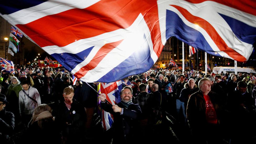 Man waving Union Jack on 31 January 2020, the day the UK left the EU