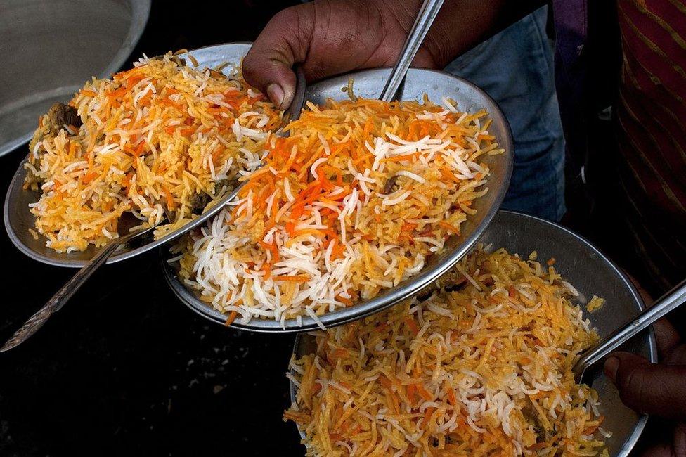 Plates of mutton biryani are served at an outside eatery in Lucknow on November 22, 2014