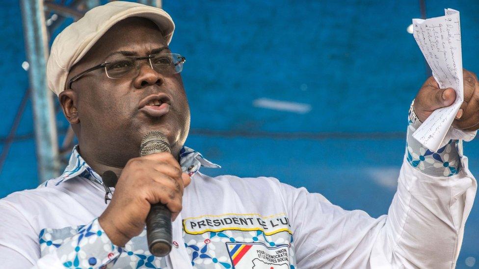 Felix Tshisekedi gestures as he addresses supporters