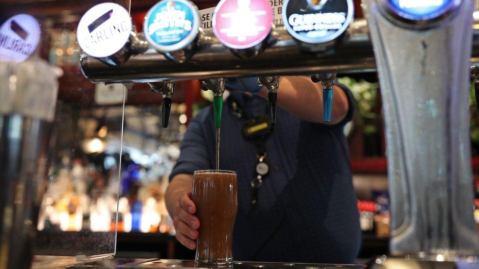 Man pours beer