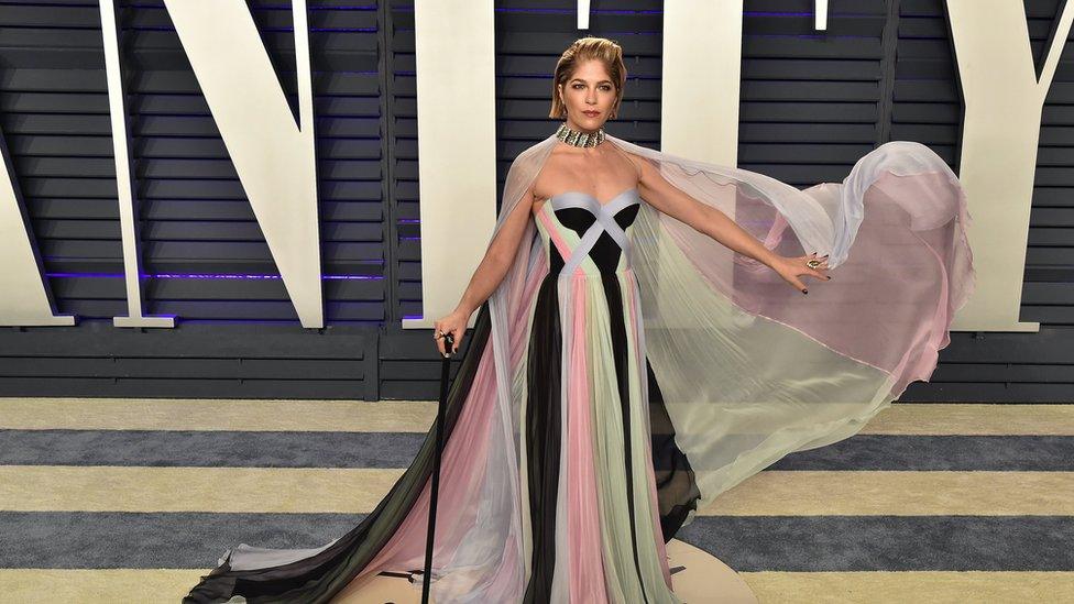 Selma Blair holding a cane on the red carpet