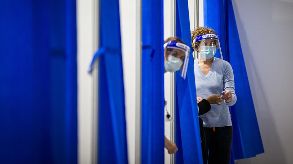 Staff are seen inside the Melbourne Exhibition Centre COVID-19 Vaccination Centre on 28 May 2021 in Melbourne, Australia