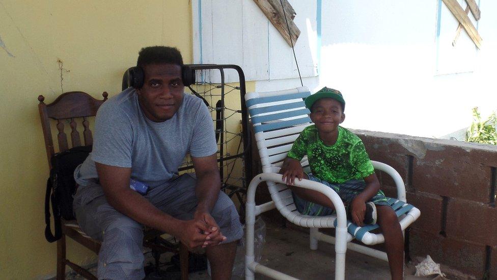 Jamieson George and son Kelijah, 10, seeking refuge at a neighbour's home