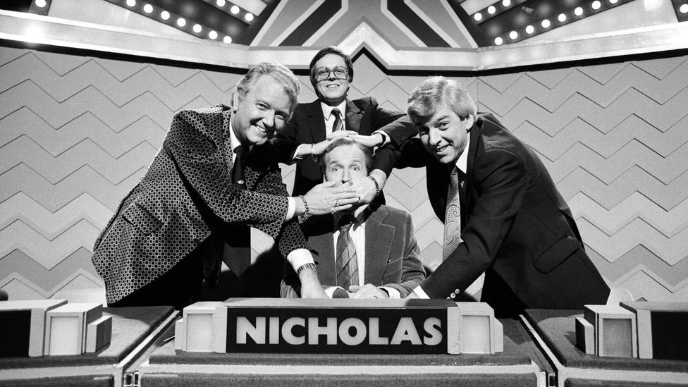 Nicholas Parsons, Tom O'Connor, Derek Batey and Steve Jones taking part in a celebrity edition of Sale of the Century in 1980