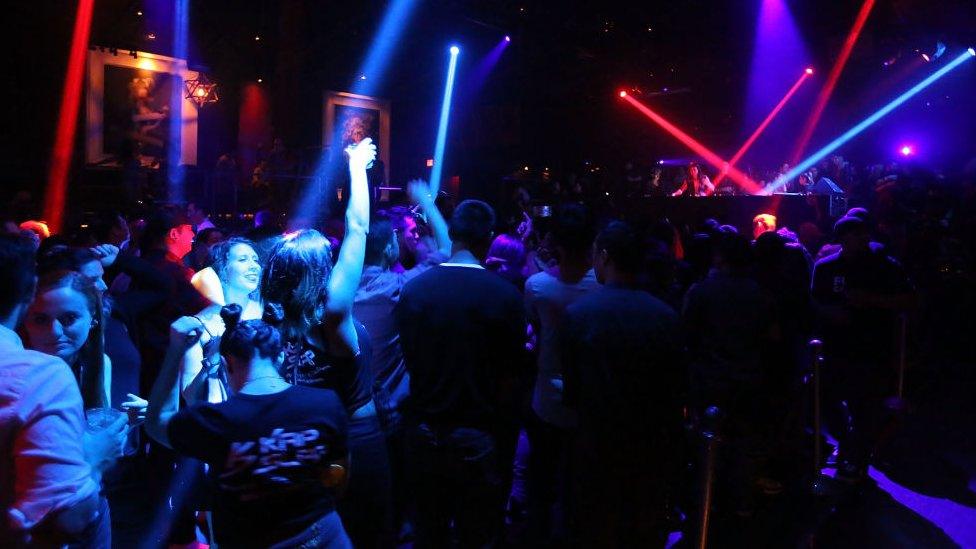 People dancing in a nightclub.