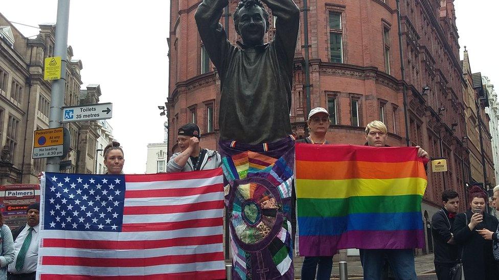 People in Nottingham gather around a statue of Brian Clough