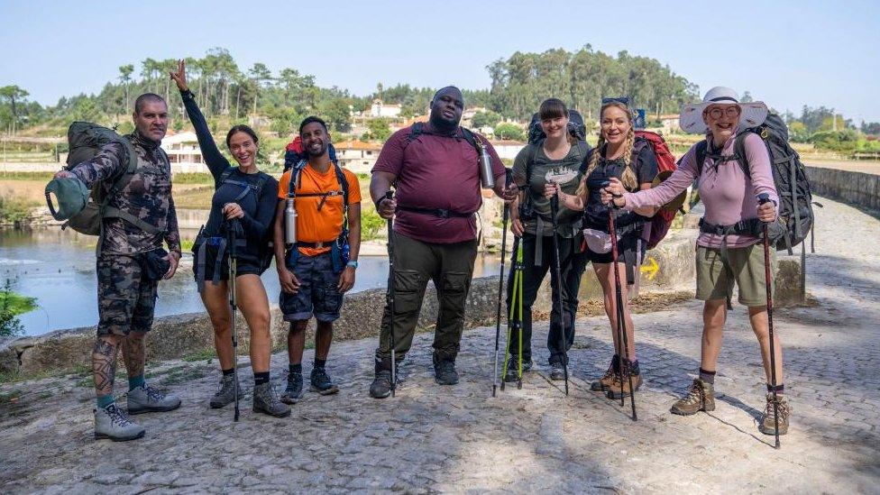 A row of people dressed for walking