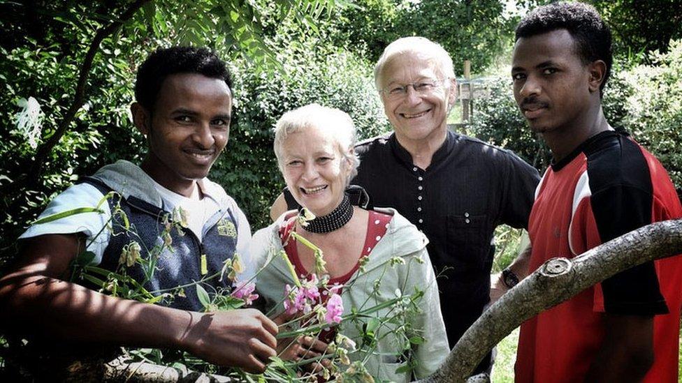 Martin Patzelt and wife flanked by the two Eritrean refugees