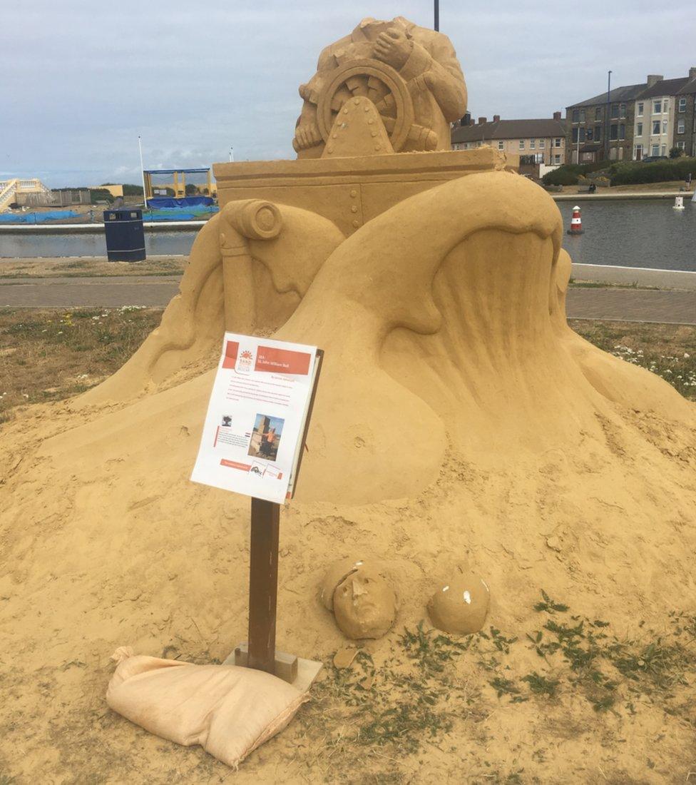 Damaged sand sculpture