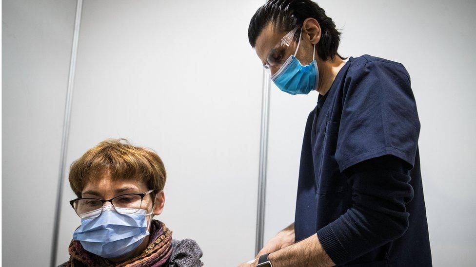 A woman receives AstraZeneca vaccine in Melbourne