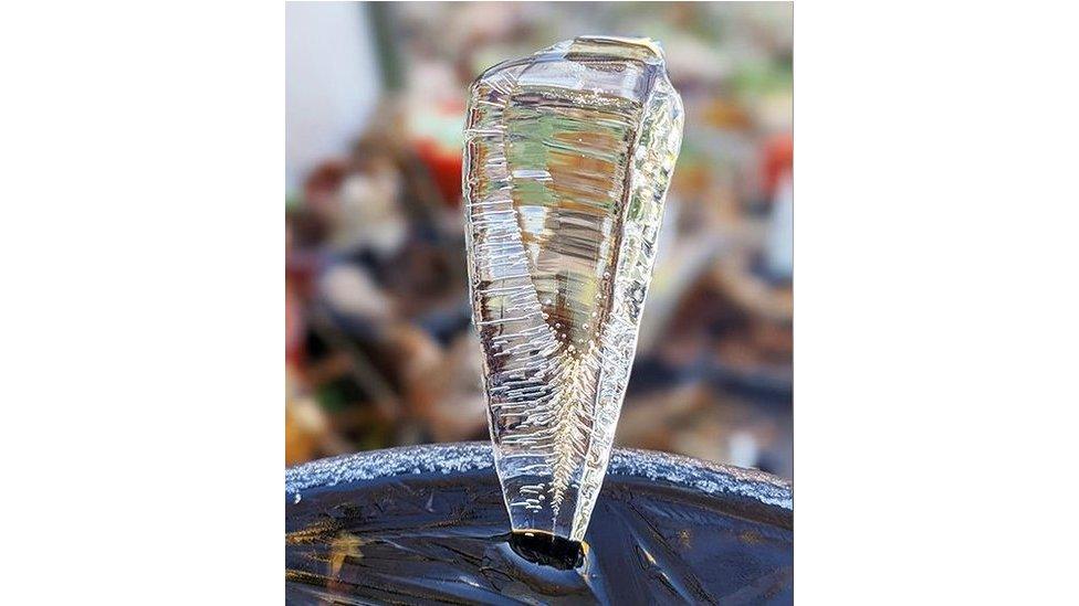 Ice spike coming from a bird bath