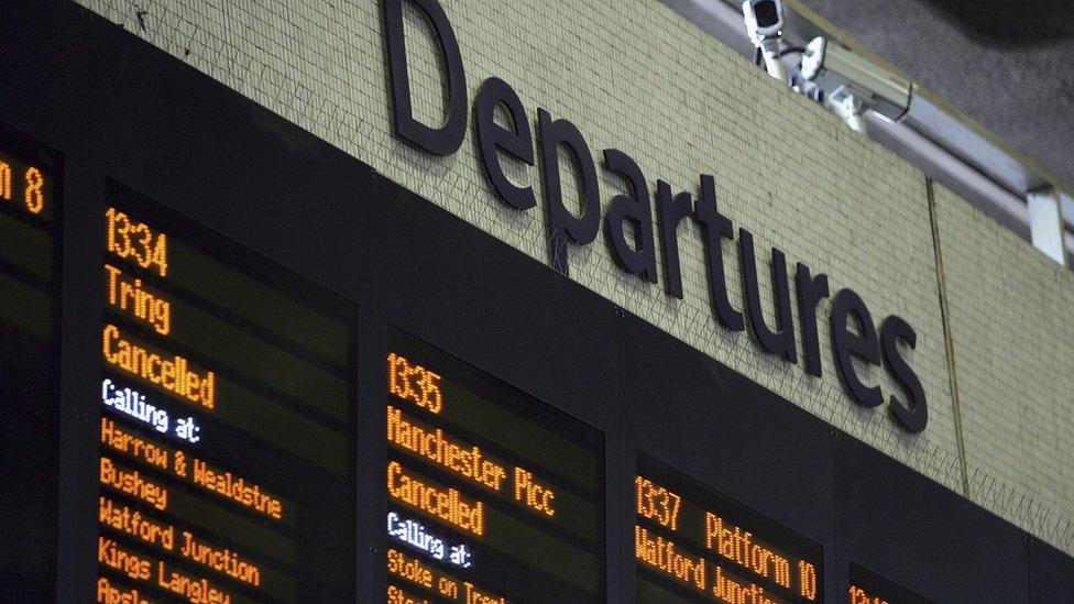 Departure board showing cancellations and delays