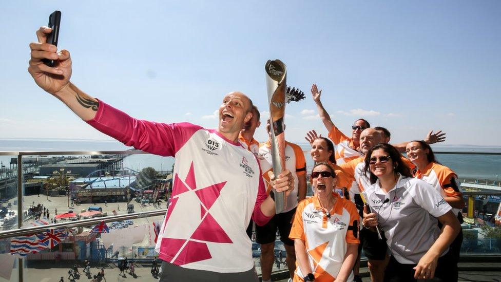 Baton bearer Dean Macey holds the Queen's Baton during the Birmingham 2022 Queen's Baton Relay on a visit to Southend-on-Sea