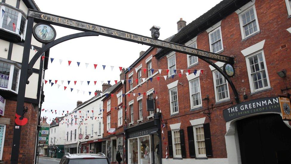 Sign above The Green Man and Black's Head Hotel