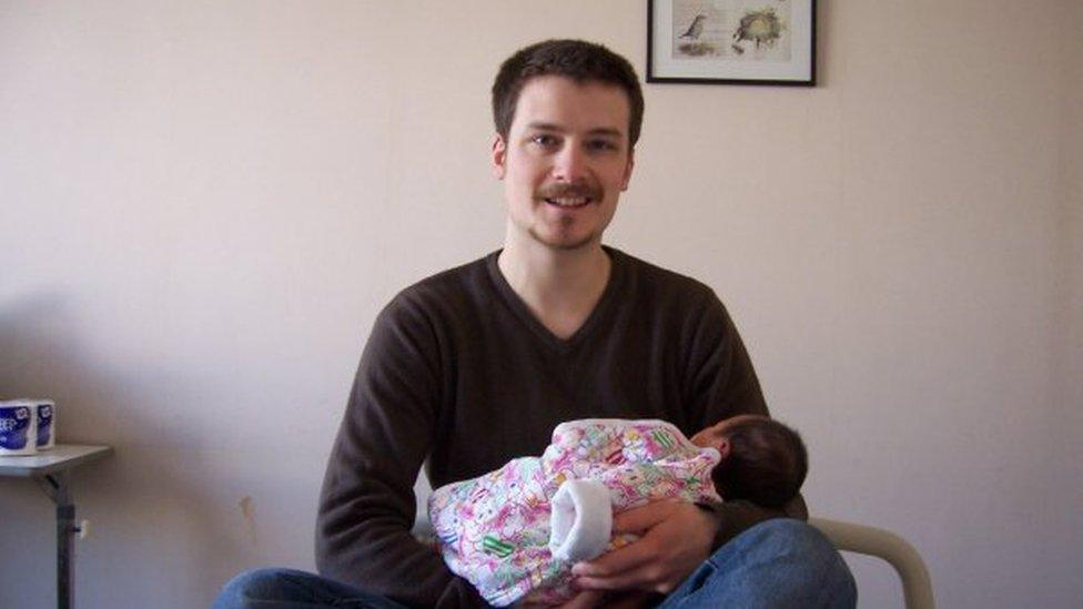 Man holding baby