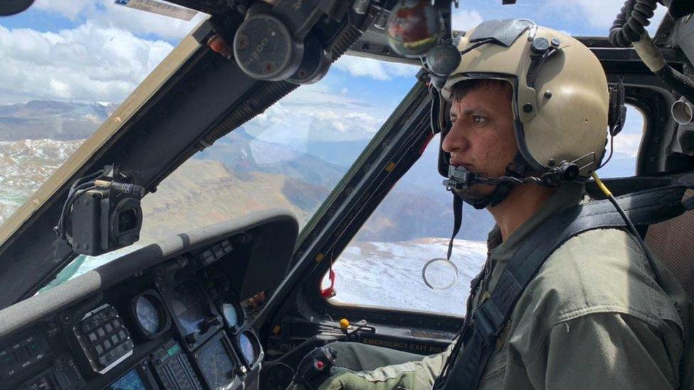 Mohammad Edris Momand flying his helicopter above Afghanistan under Taliban rule