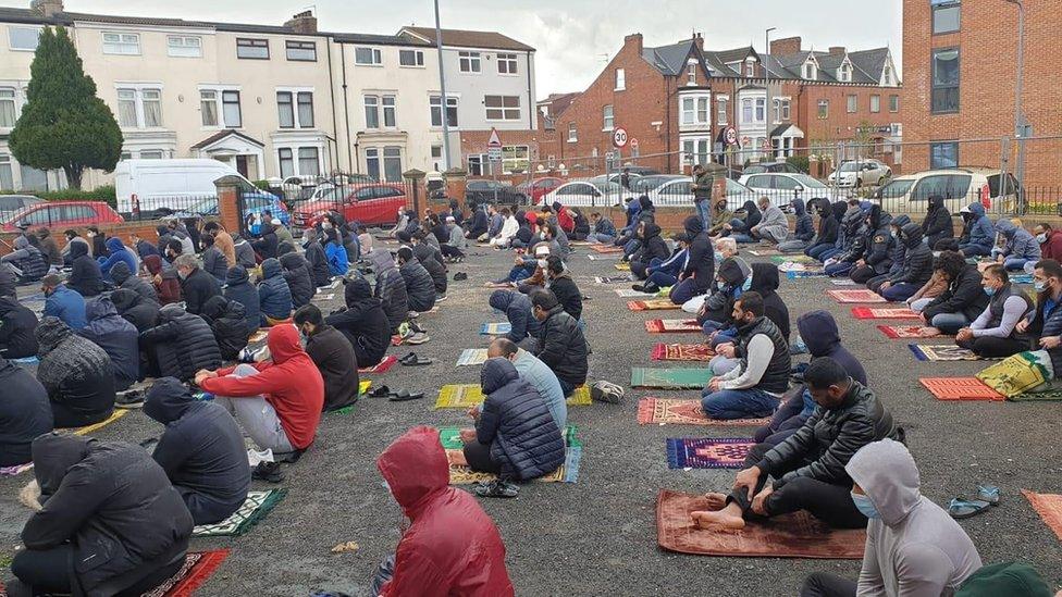 Worshippers outside the Central Masjid