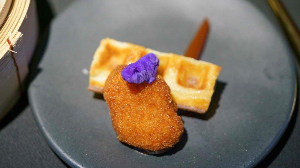 A nugget made from lab-grown chicken meat is seen during a media presentation in Singapore, the first country to allow the sale of meat created without slaughtering any animals, on December 22, 2020