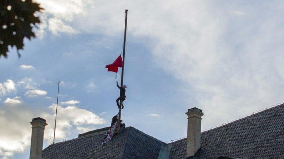 Czech protesters raise a pair of underpants in protest against President Milos Zeman