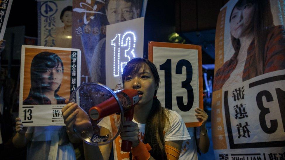 Localist political group Youngspiration candidate Yau Wai-ching (C) campaigns during the Legislative Council election in Taikoo, Hong Kong on September 4, 2016