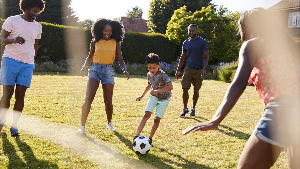 Family Playing Football