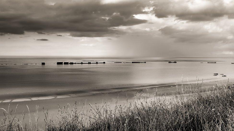 The remains of the D-Day 'Mulberry' artificial harbour at Arromanches, Normandy