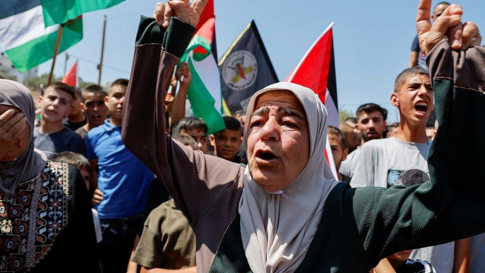 Mourners react during the funeral of Othman Abu Kharj, who was killed in an Israeli military raid in Zababdeh, in the occupied West Bank (22 August 2023)