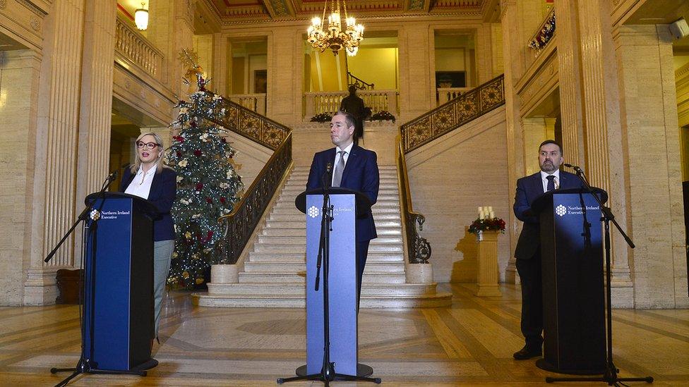 Michelle O'Neill, Paul Givan and Robin Swann speak to the media in the Great Hall in Stormont's Parliament Buildings