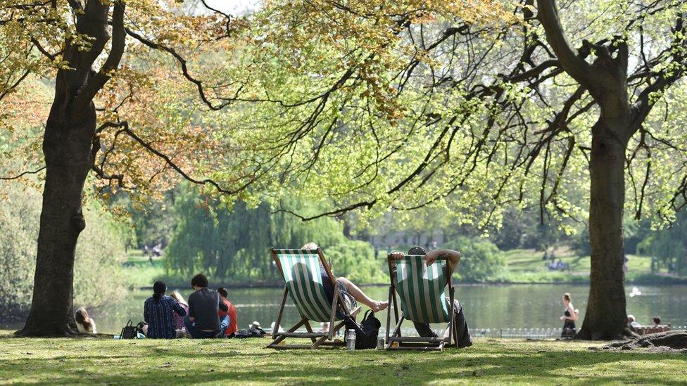 People relaxing in the shade