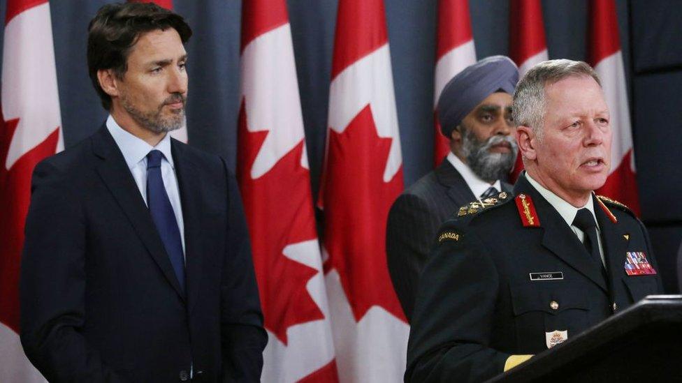 Canadian Prime Minister Justin Trudeau (L), Minister of National Denfence Harjit Sajjan (C) listen as Chief of Defence Staff General Jonathan Vance addresses the media during a news conference January 8, 2020 in Ottawa, Canada