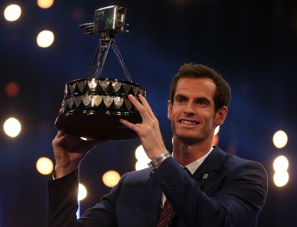 Andy Murray lifts the SPOTY trophy