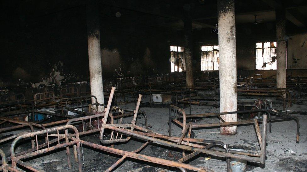 Bed frames are strewn in a burnt-out dormitory of the Balochistan police college in Quetta on 26 October 2016, a day after the militants' attack.