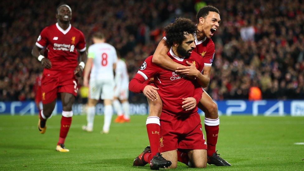 Mohamed Salah of Liverpool celebrates after scoring his side's seventh goal with Trent Alex Arnold of Liverpool during the UEFA Champions League group E match between Liverpool FC and Spartak Moscow at Anfield on December 6, 2017 in Liverpool, United Kingdom