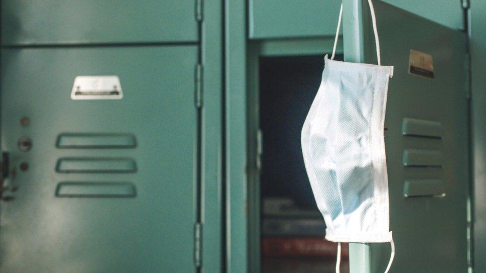 facemask hanging on a locker