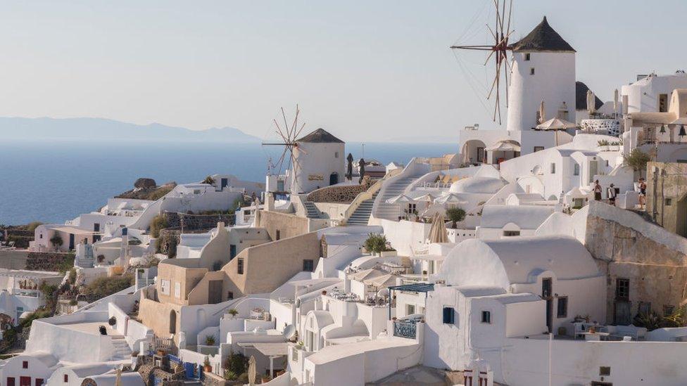 Traditional Windmill at Oia village on July 16 2018 in Santorini, Greece