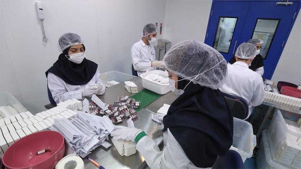 Pharmaceutical factory workers package Metoprolol tablets at the Actoverco plant in Karaj, Iran (18 February 2020)