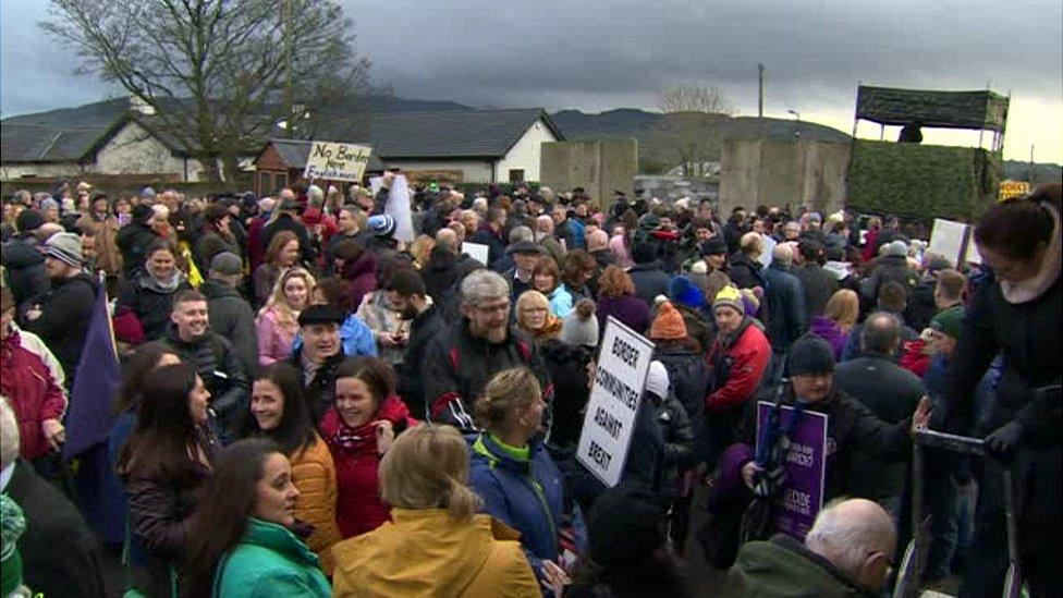 Protesters holding placards