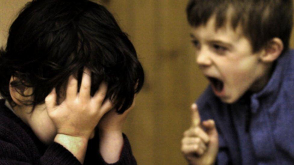 Two boys, one shouting (modelled)