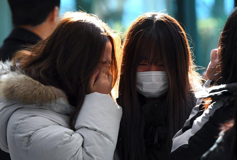 Tearful fans gather to visit the mourning altar for Kim Jong-Hyun, a 27-year-old lead singer of the massively popular K-pop boyband SHINee, at a hospital in Seoul on 19 December 2017.