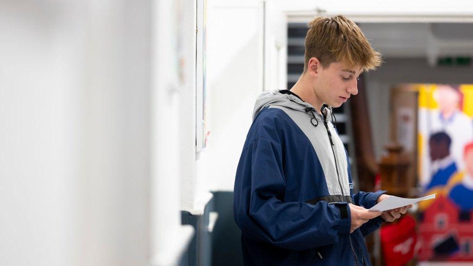 A student looking at his exam results