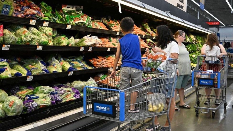 Grocery shoppers in aisle