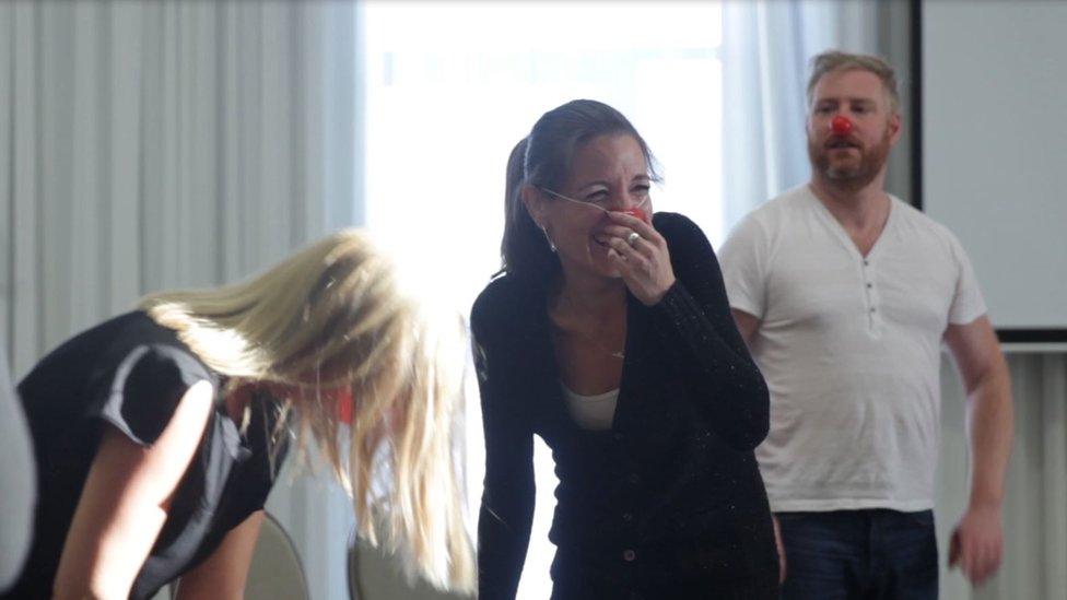 Participants at a National Comedy School business training event