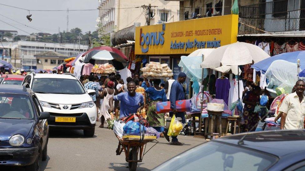 People shopping at a market in Libreville, March 2023